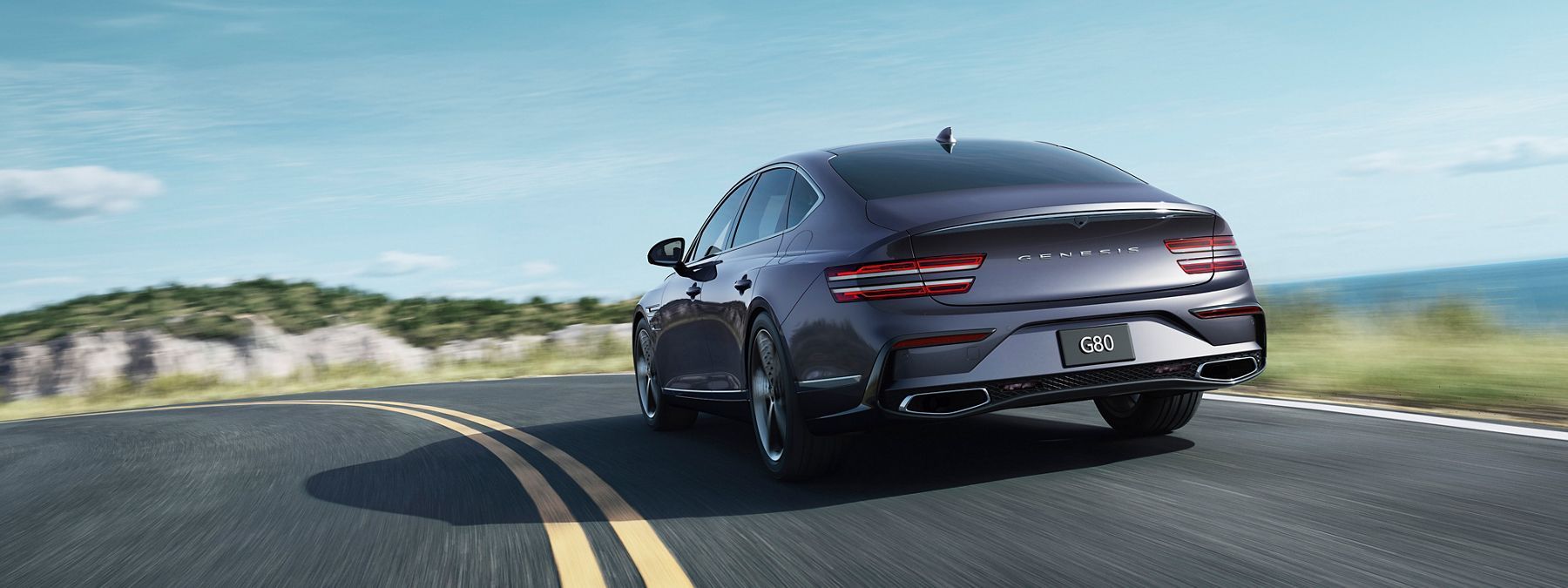 Genesis G80 sedan on a coastal road